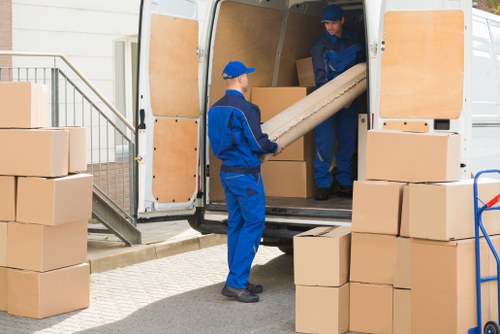 Removal team planning a local move in Rush Green