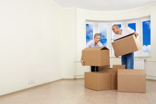 Loading boxes and furniture into a local removals van