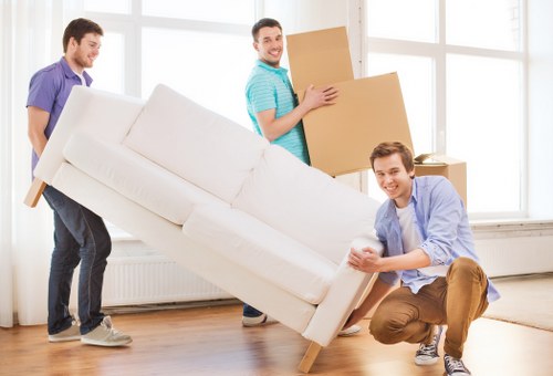 Furniture being carried carefully during a local removal service