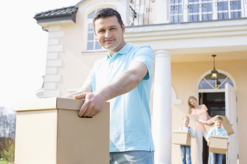 House removal team preparing a move in Rush Green street setting