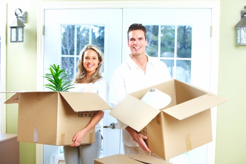 Local movers preparing boxes for a Rush Green relocation