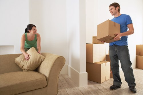 Packing boxes and furniture for a house move in Rush Green